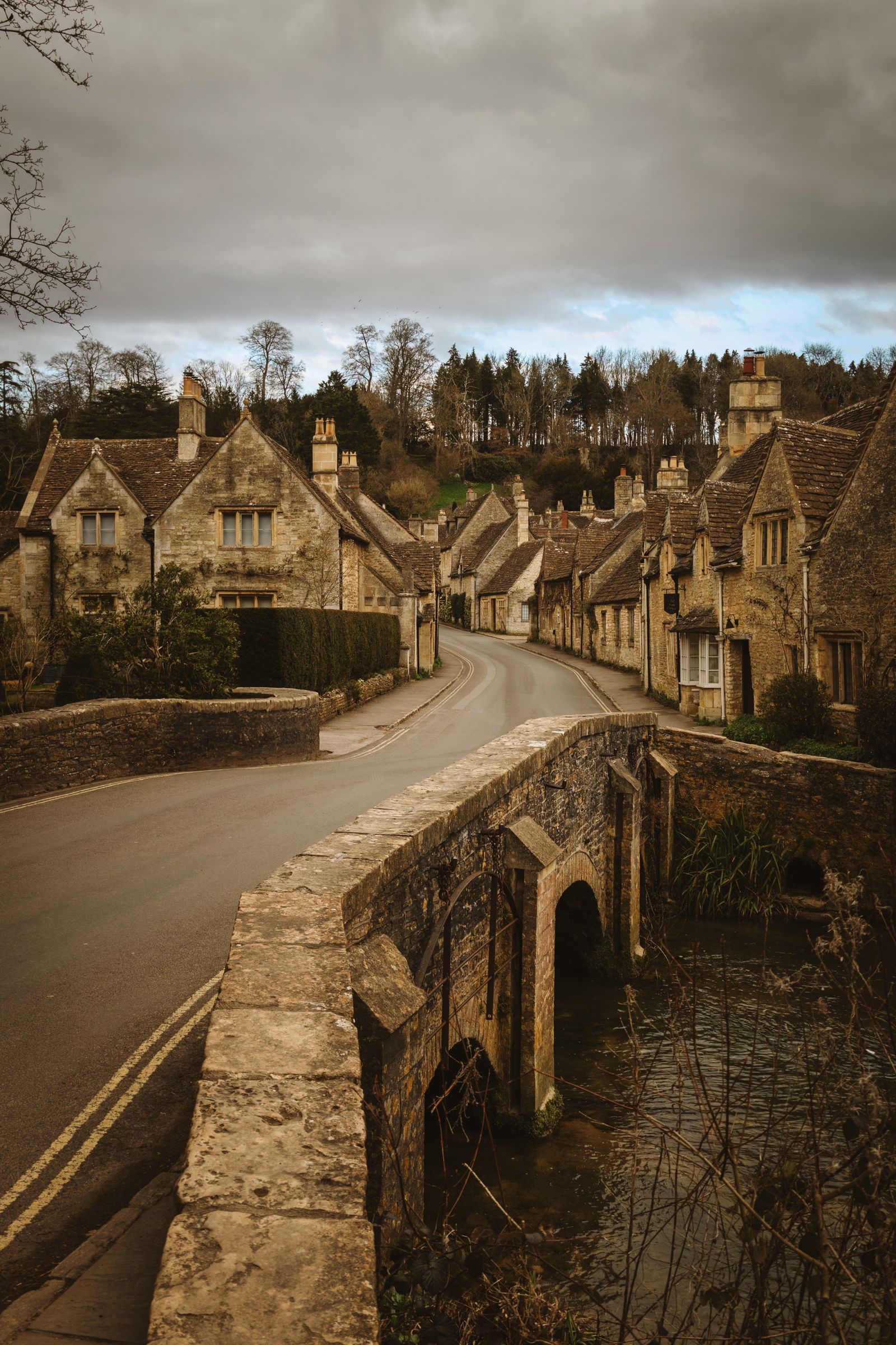 Stone cottages and bridge in a Cotswolds village