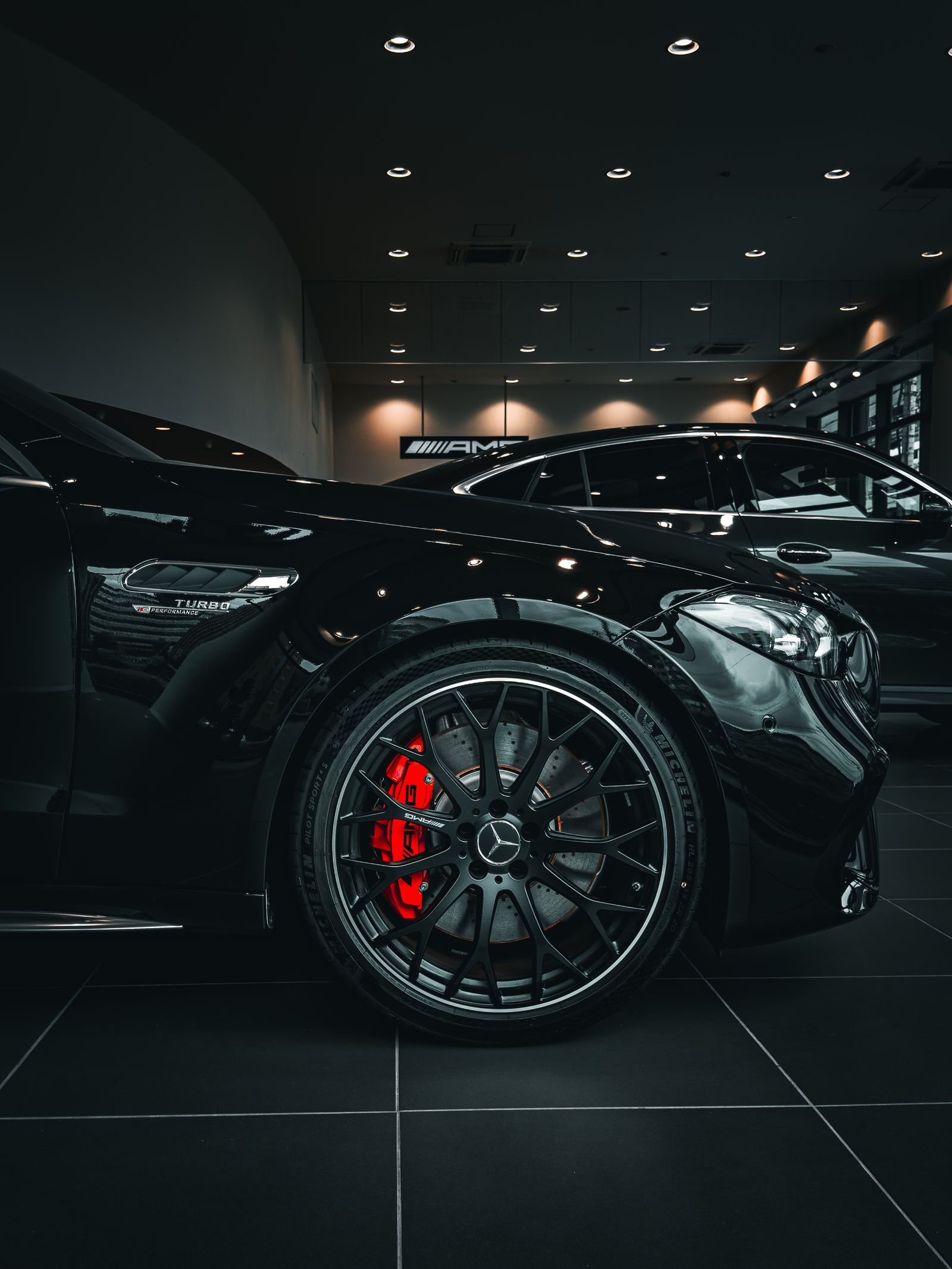 Detail of a black Mercedes-Benz under low evening light