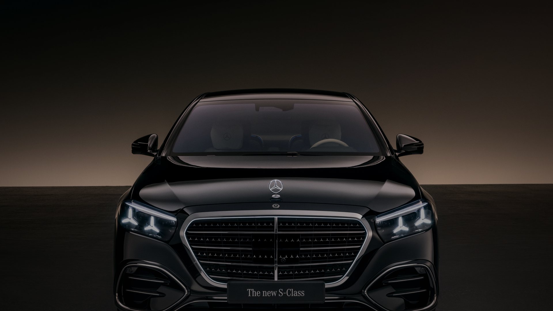 Current black Mercedes-Benz S-Class in a dark cinematic setting
